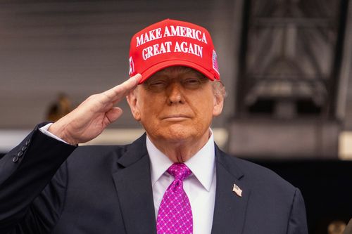 President Donald Trump salutes during the United States Military Academy commencement ceremonies in West Point on May 24