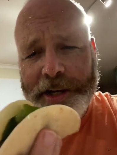 Man eating hotdog