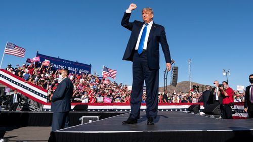 President Donald Trump arrives to speak at a campaign rally at Carson City Airport