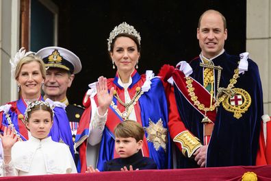 Kate, Princess of Wales, centre, waves from the balcony of Buckingham Palace with Prince William, right, Princess Charlotte, down left, and Prince Louis, down centre, during the coronation of Britain's King Charles III, in London, Saturday, May 6, 2023.
