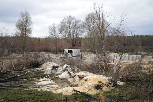 Russian trenches and firing positions made in the highly radioactive Red Forest stuffed with radioactive remnants near the Chernobyl nuclear power plant.