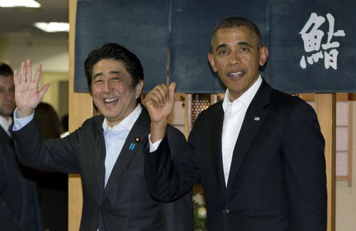 Then President Barack Obama and then Japanese Prime Minister Shinzo Abe depart Sukiyabashi Jiro sushi restaurant in Tokyo, Wednesday, April 23, 2014 