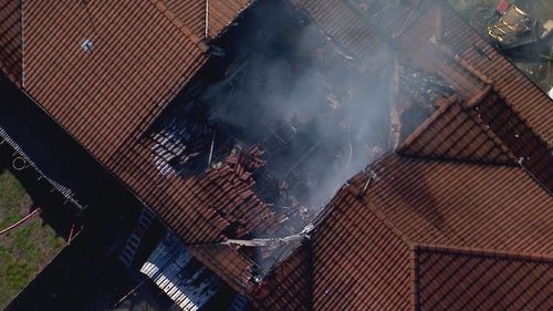 One person has died and another is missing after a fire tore through townhouses in Thorneside, Brisbane