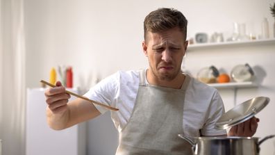 man disgusted by food