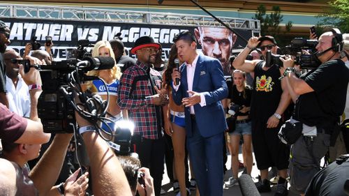 Mayweather Jr. is interviewed as he arrives at Toshiba Plaza. (Getty)