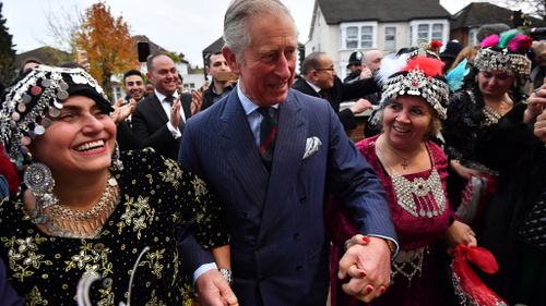 Princes Charles has joined in on a traditional dance outside a Syrian church in London. (AAP)