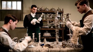 Downton Abbey the movie - valets polishing silver in the house 