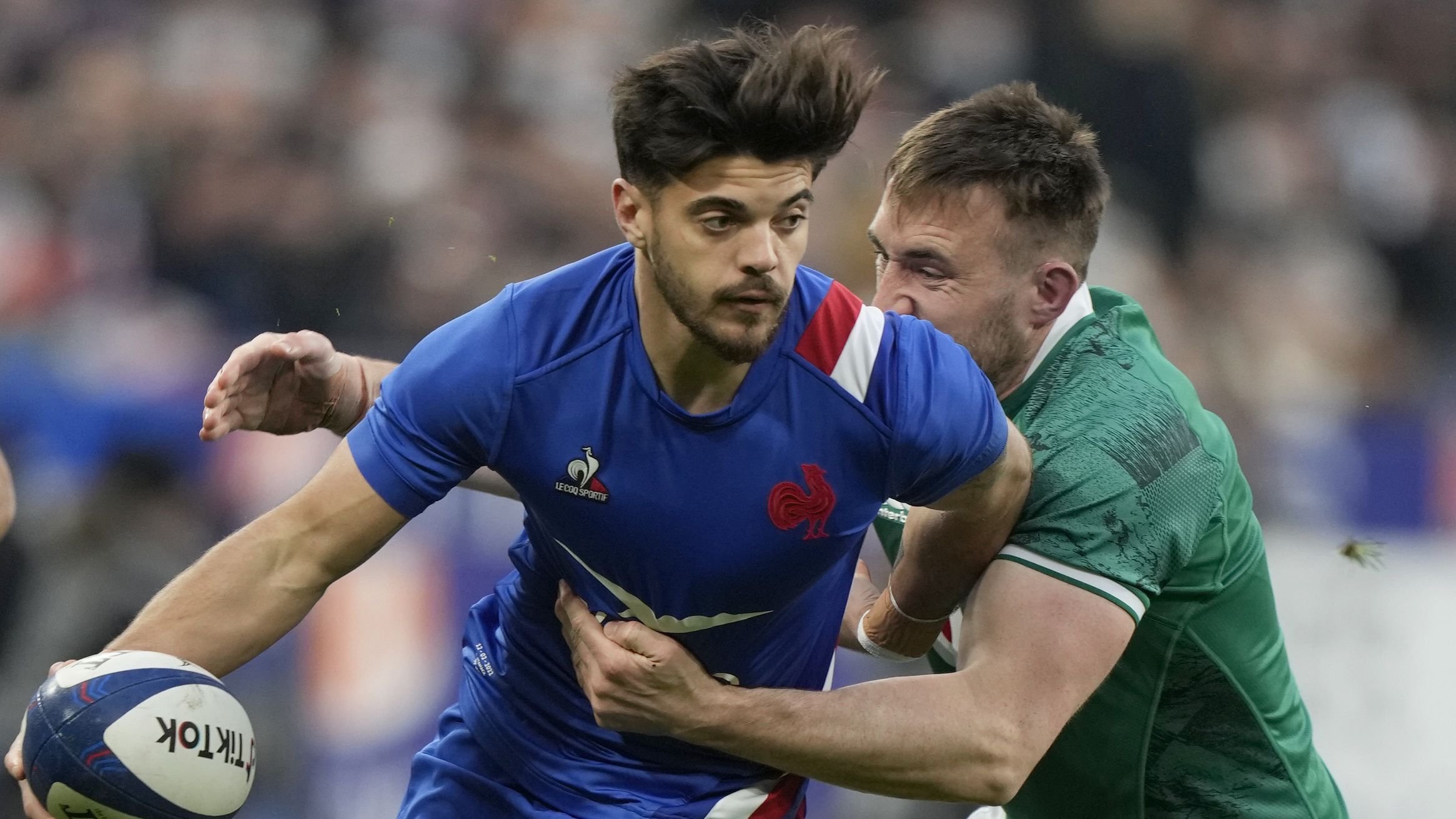 Romain Ntamack of France passes the ball as he is tackled by Ireland&#x27;s Jack Conan during the Six Nations.