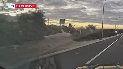Heart-stopping dashcam vision has been captured showing a frightening crash on the Kwinana Freeway in Perth.
It shows a car driving at speed, colliding with a concrete gutter and mounting the verge, flipping and rolling multiple times.