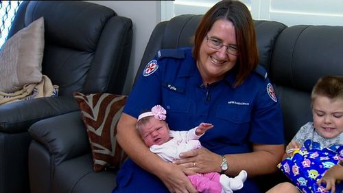 Triple Zero call taker Kylie Crebbert reunited with the baby girl she helped deliver over the phone (9NEWS)