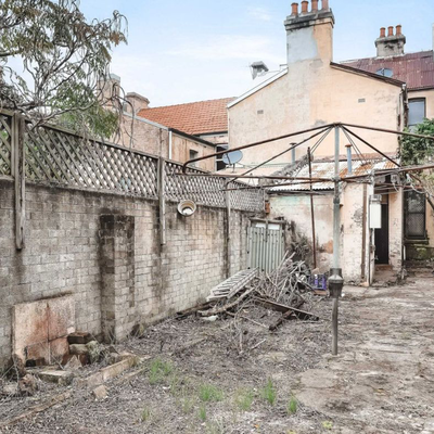 Neglected Redfern terrace with a backyard like a deserted wasteland sells at auction for $1.25 million