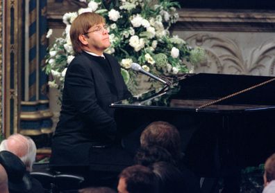 Elton John plays a specially re-written version of his song "Candle in the Wind" during the funeral service for Diana, Princess of Wales, at London's Westminster Abbey in this Saturday, September 6, 1997