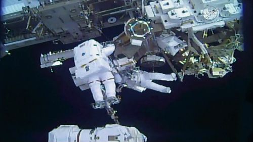 Astronauts Mark Vande Hei and Norishige Kanai complete the robot arm transfer. (NASA)