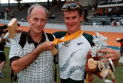 Rogers celebrates with his dad after a gold medal at the '98 Commonwealth Games. (AAP)