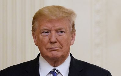 President Donald Trump listens during an event about the Paycheck Protection Program. 