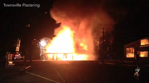 A streetlight crackles and melts as the historic pub burns. Picture: Townsville Plastering