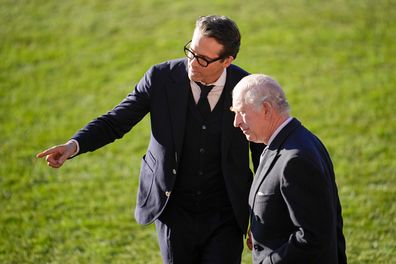 Co-Owner Wrexham AFC Ryan Reynolds welcomes King Charles III during their visit to Wrexham AFC on December 09, 2022 in Wrexham, Wales.  
