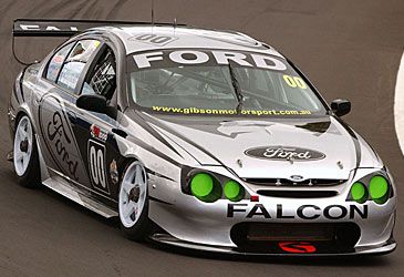 When did Craig Lowndes controversially switch from racing Holdens to Fords?