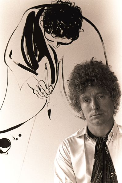 Brett Whiteley with a painting of his.
