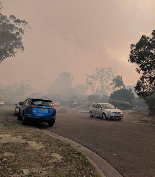 Thick smoke hangs over the streets of south-western Sydney. (Luke Cooper)