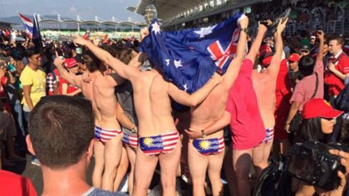 The Aussies celebrate countryman Daniel Ricciardo's win. (Nick Asyraaf/Twitter)