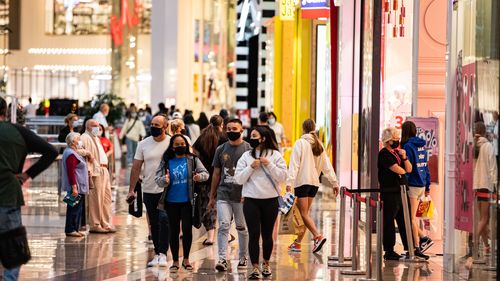 MELBOURNE, AUSTRALIA - DECEMBER 26: Early risers line up outside a store to catch the Boxing Day sales at Chadstone the Fashion Capital  during the Boxing Day sales on December 26, 2021 in Melbourne, Australia. Australians celebrate Boxing Day with many taking advantage of the post-Christmas sale prices in what is usually the busiest day of the year for retailers in Australia. In Sydney, thousands of people usually gather around and on the harbour to watch the start of the Sydney to Hobart yacht