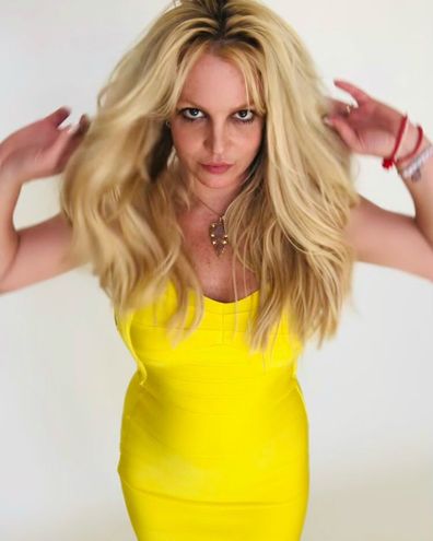 Britney Spears celebrates newfound freedom from conservatorship by donning a yellow dress in an Instagram post