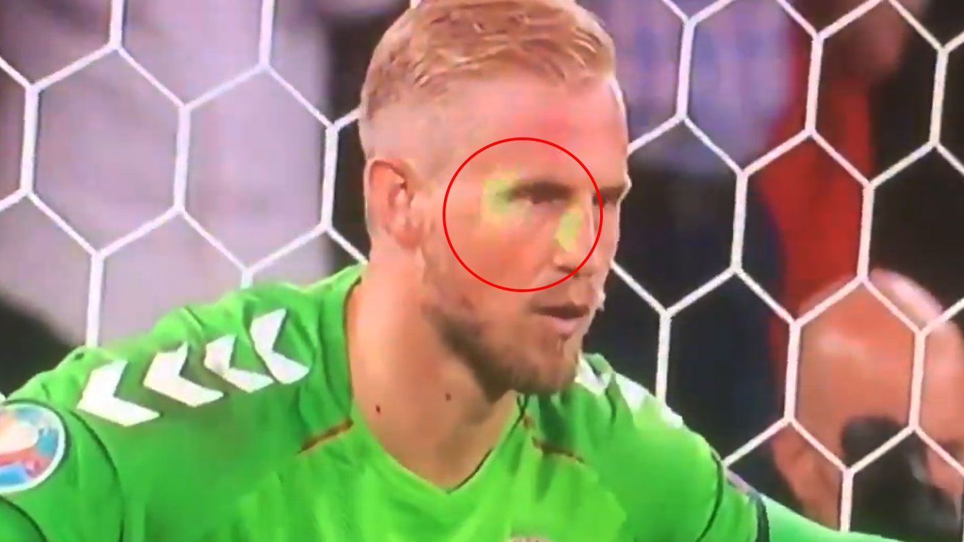 'Banned for life': Football fans explode after crowd member shines laser-pointer in Kasper Schmeichel's face during penalty
