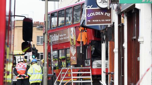 The bus hit a kitchen design store in Lavender Hill. (AAP)