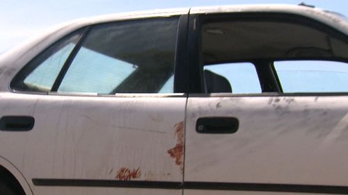 Blood smears on the victims car. (9NEWS)