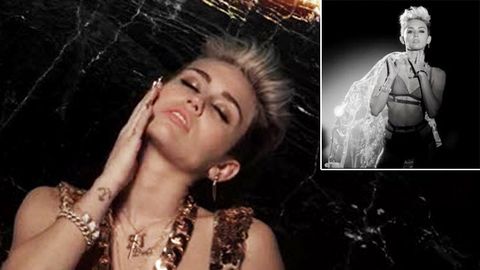 Phwoar! Miley Cyrus strips down for rapper's new music video