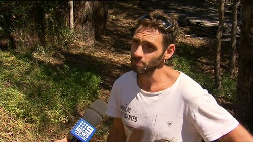 The mates took turns dousing each other in water as they battled the searing blaze. (9NEWS)
