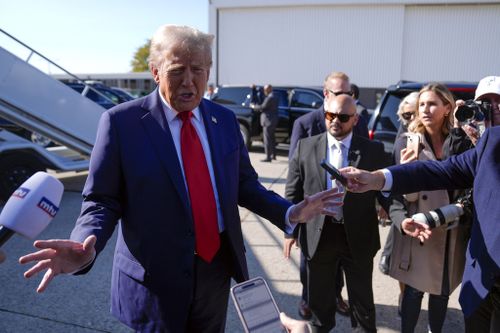 Republican presidential nominee former President Donald Trump speaks to reporters as he arrives at Detroit Metropolitan Wayne County Airport, Friday, Oct. 18, 2024, in Detroit. (AP Photo/Evan Vucci)