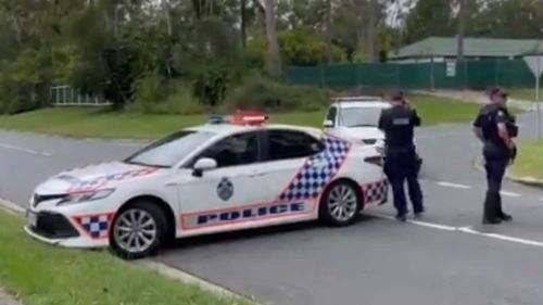 Police cordoning off a street in Ormeau, Queensland.