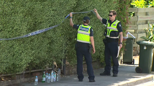 Detectives block off the home where the woman was found dead. (9NEWS)