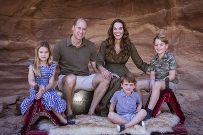 Prince William and Kate, Duchess of Cambridge pose with their children Prince George, right, Princess Charlotte and Prince Louis for their annual Christmas card, during their visit to Jordan