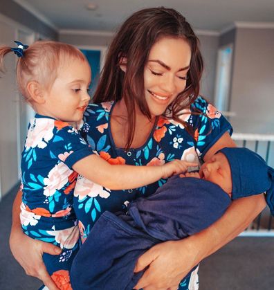 Skye with her two children, two-year-old daughter Mia, and newborn Izaac.