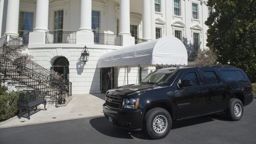 An SUV is parked outside of the South Portico on the South Lawn of the White House in Washington, DC, March 11, 2017. (AFP)