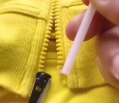 DIY zipper repair with plastic straw