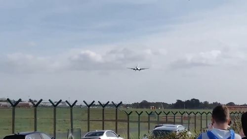 The Ryanair flight from Brussels to Dublin approaches warily in the high winds.