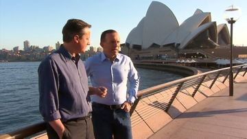 British Prime Minister David Cameron with Australian counterpart Tony Abbott walk along Sydney Harbour.