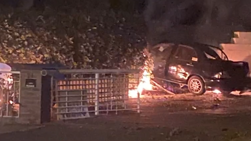 An allegedly stolen car hit a power pole and erupted in flames. 