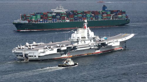 The Liaoning, China's first aircraft carrier, sails into Hong Kong for a port call.