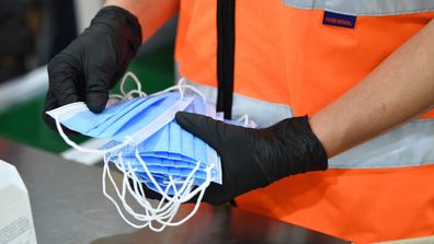 Close up of face masks on the production line of the Detmold PPE production facility in Brompton, Adelaide.