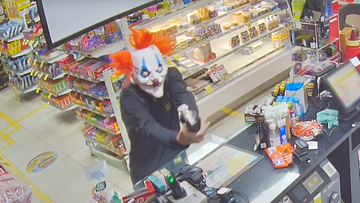 The clown allegedly robbed a service station of cash in Brisbane.