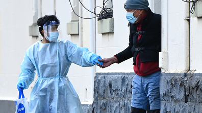 Residents of Hambleton House are put in Patient Transport vehicles on August 17, 2020 in Melbourne, Australia. Health authorities are investigating Hambleton House in Albert Park following a coronavirus outbreak among residents. 