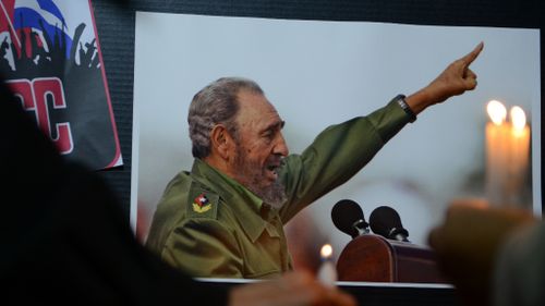 Many held pictures of Castro in remembrance of the leader. (AFP)