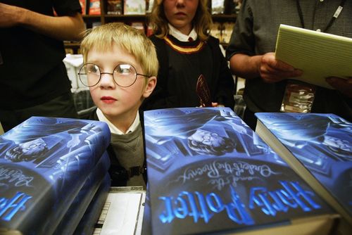In 2003 a young boy waits for his chance to purchase a copy of the new 'Harry Potter and the Order of the Phoenix' book by J.K. Rowling