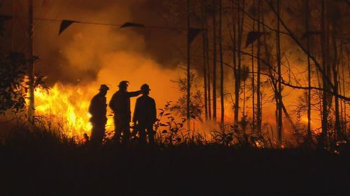 'Too close to home': Almost 50 properties lost as Queensland firefighters race to contain bushfire before conditions worsen - 9News