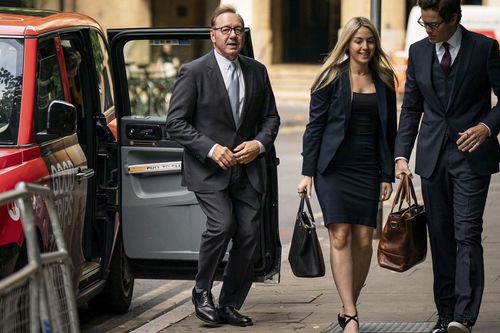 Actor Kevin Spacey, left, arrives at Southwark Crown Court, London, where he is charged with three counts of indecent assault, seven counts of sexual assault, one count of causing a person to engage in sexual activity without consent and one count of causing a person to engage in penetrative sexual activity without consent between 2001 and 2005, on Thursday July 13, 2023. 